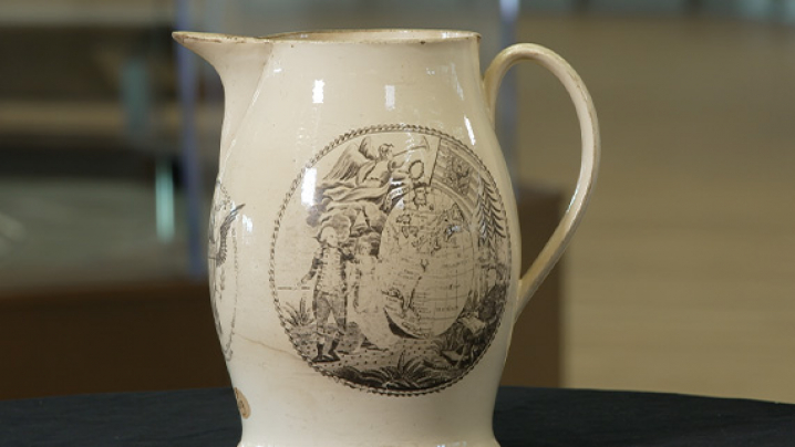 A 10 inch tall cream ware pitcher.