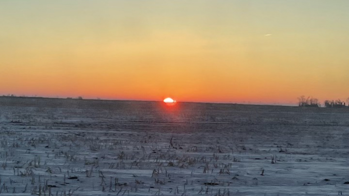 sunset over frozen field