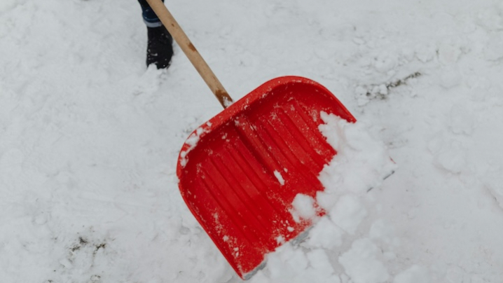 red shovel in deep snow