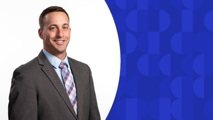 A man in a grey suit.