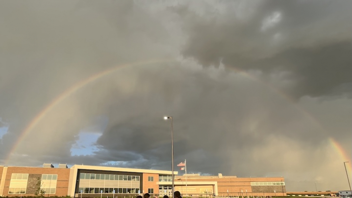 rainbow over a school building