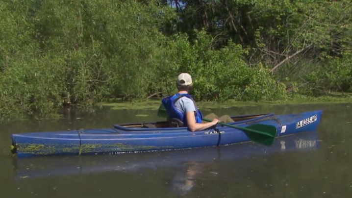 canoe reflecting on the water