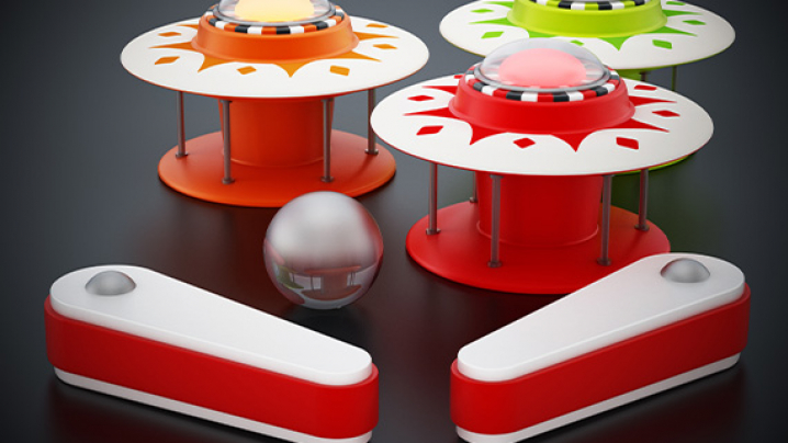 Colorful arcade game components including a central silver ball, three vibrant game units, and two red flippers on a dark surface.