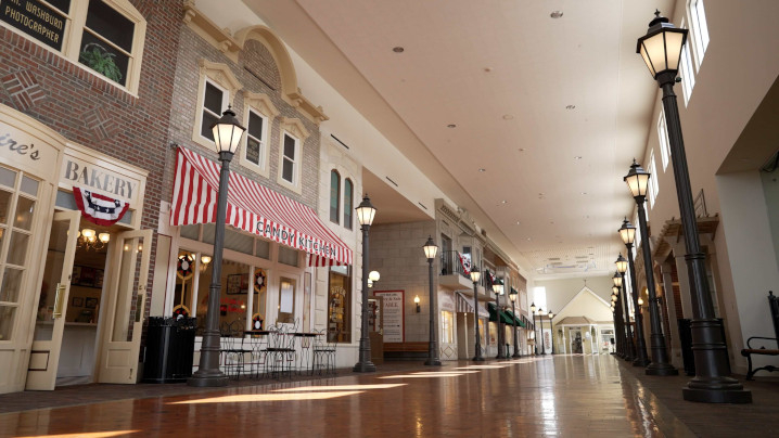 Numerous facades form a historical street inside a building.