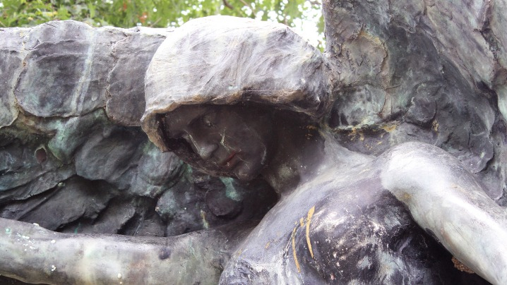 A sculpture of an angel with large wings.