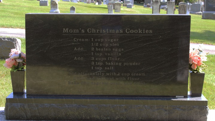 The back of a black gravestone with a recipe engraved.