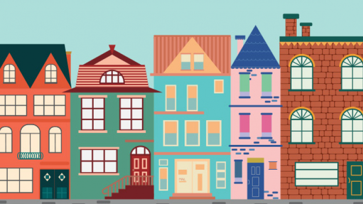 Stylized colorful row of repeating urban buildings with varied roofs, windows, storefronts, and a gray street.