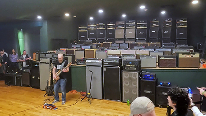 Jon Locker breaks a world record by playing for five full minutes through 81 guitar/bass amps in the newly restored Val Air Ballroom in West Des Moines.