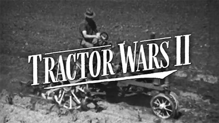 A black and white photo of an old tractor in a dirt field. The logo of Tractor Wars II hovers overtop the tractor