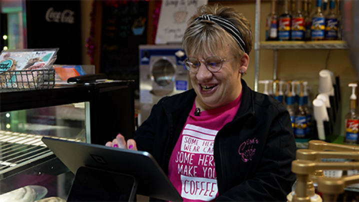 Emilea "Em" Hillman rings up an order at the cash register.