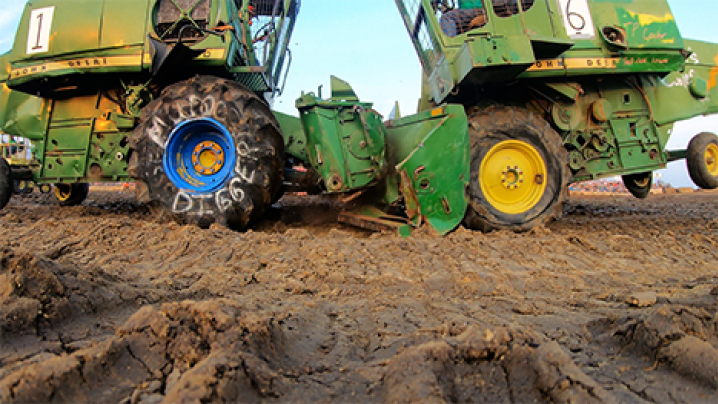 Two green combines go head-to-head during a combine demolition derby!