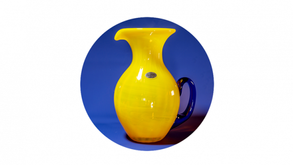 Citrine colored glass pitcher with cobalt blue handle