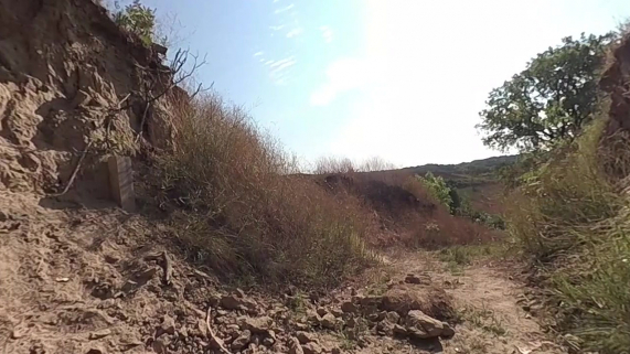 A hiking path with a loess soil mound on the left.