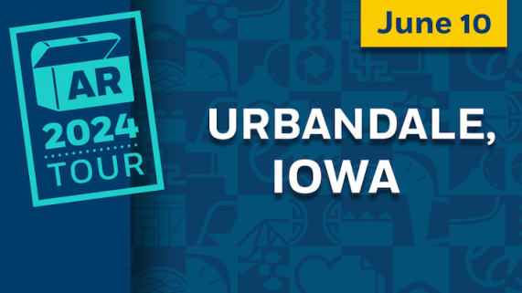 A blue graphic with white text reading "Urbandale, Iowa" featured prominently in the center. A teal Antiques Roadshow tour logo on the left. The logo includes an open trunk with the letters "AR" on the front and "2024 tour" below the trunk. The graphic also contains "June 10" in a yellow text box in the upper right corner.