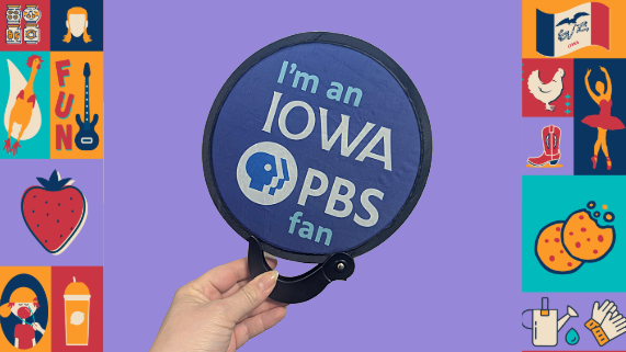 A hand holding a fan that reads "I'm an Iowa PBS Fan"