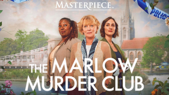Three women in front of a scenic backdrop with a church spire and police tape.