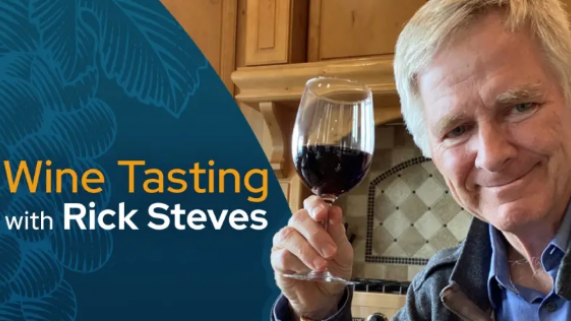 Rick Steves holding wine glass
