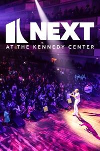 Poster art which shows a performer onstage in front of a crowd.