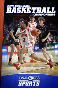 A teenage boy runs down the court while dribbling a basketball.