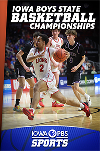 A teenage boy runs down the court while dribbling a basketball.