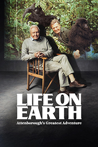Life on Earth: Attenborough’s Greatest Adventure logo, plus David Attenborough sitting in a chair, legs crossed, in front of a picture of a younger version of himself in amongst c couple gorillas in the wild.