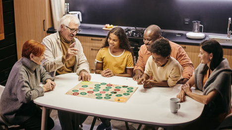 a family around a table playing a game