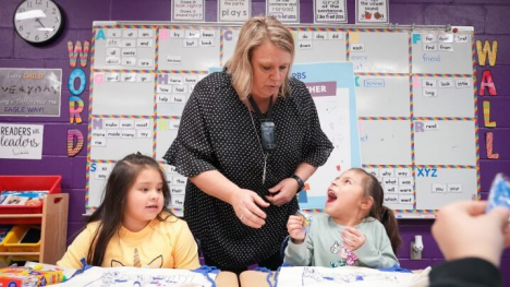 Mrs. Conaway working with students in the classroom