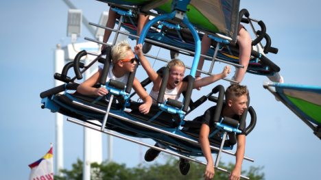 Midway ride for a trio of kids