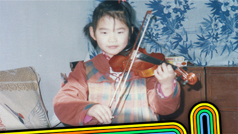 Little girl playing the violin in a vintage photo