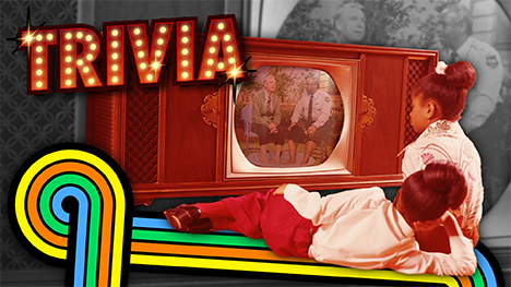 TRIVIA - An old photo of two girls sitting in front of an old TV while watching Mister Roger's Neighborhood.