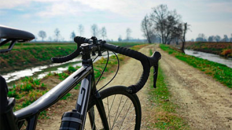Bike standing on a gravel road.