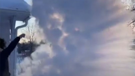 Hot water tossed into frigid air.