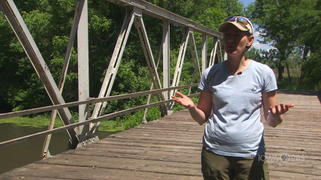 Image of a woman on a bridge.