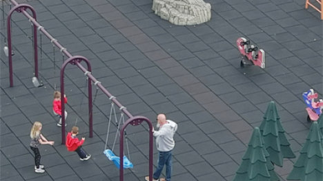 Children swinging on a playground.