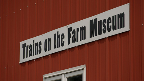 A sign for Trains on the Farm.