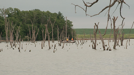 Men in a fishing boat fishing on Lake Belva Deer in Sigourney.