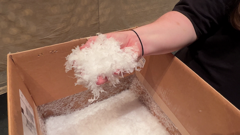 Hand holding fake snow for a theater performance