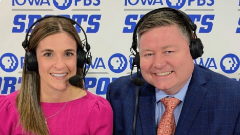 volleyball announcers Beth West and Ericc Braley at the announcers' desk