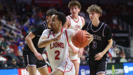Man in white uniform playing basketball 