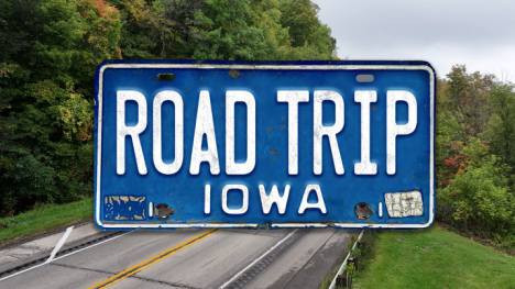 A blue license plate reads "Road Trip Iowa."