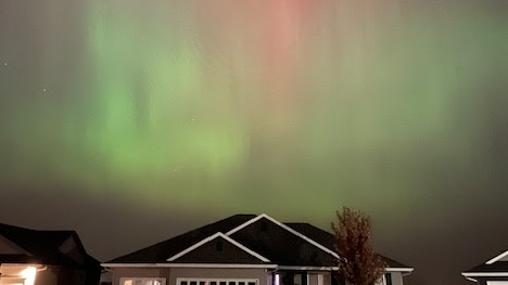 aurora over a house