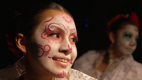 a person with Day of the Dead face paint