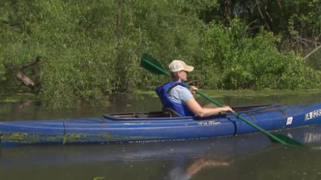 canoe reflecting on the water