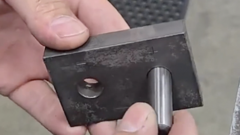 Metal pin inserted into metal block
