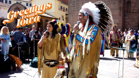 Kelly Montijo Fink and friend sing/perform in in Native American Apache clothes.