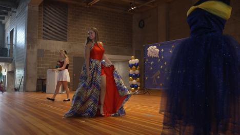 A fashion show on a stage.