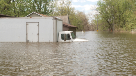 A partially submerged moving truck.