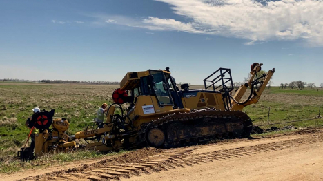 bulldozer plowing fiber optic cables