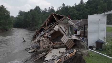 damaged house on river