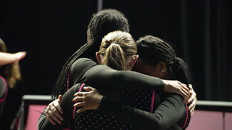 Dancers hug in a moment of support at the 2024 Iowa State Dance Team Championships.